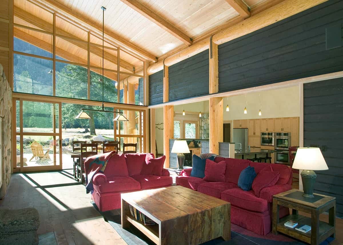 Great room interior with red sofas and open kitchen beyond