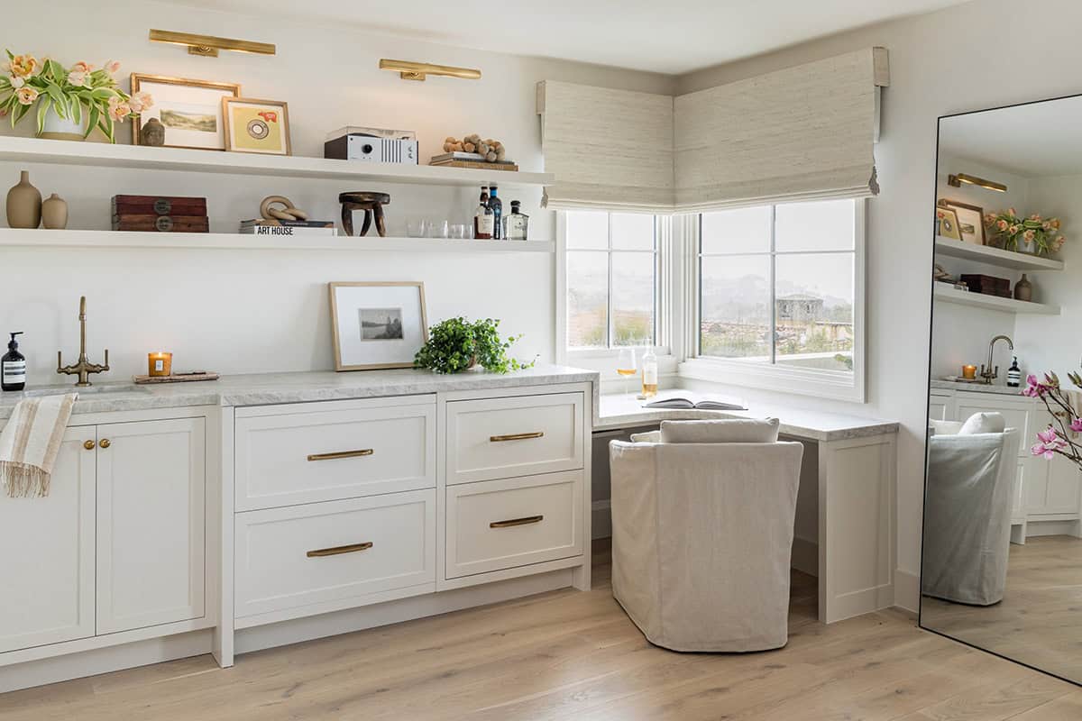 Corner window seat with marble bar counter and shelving