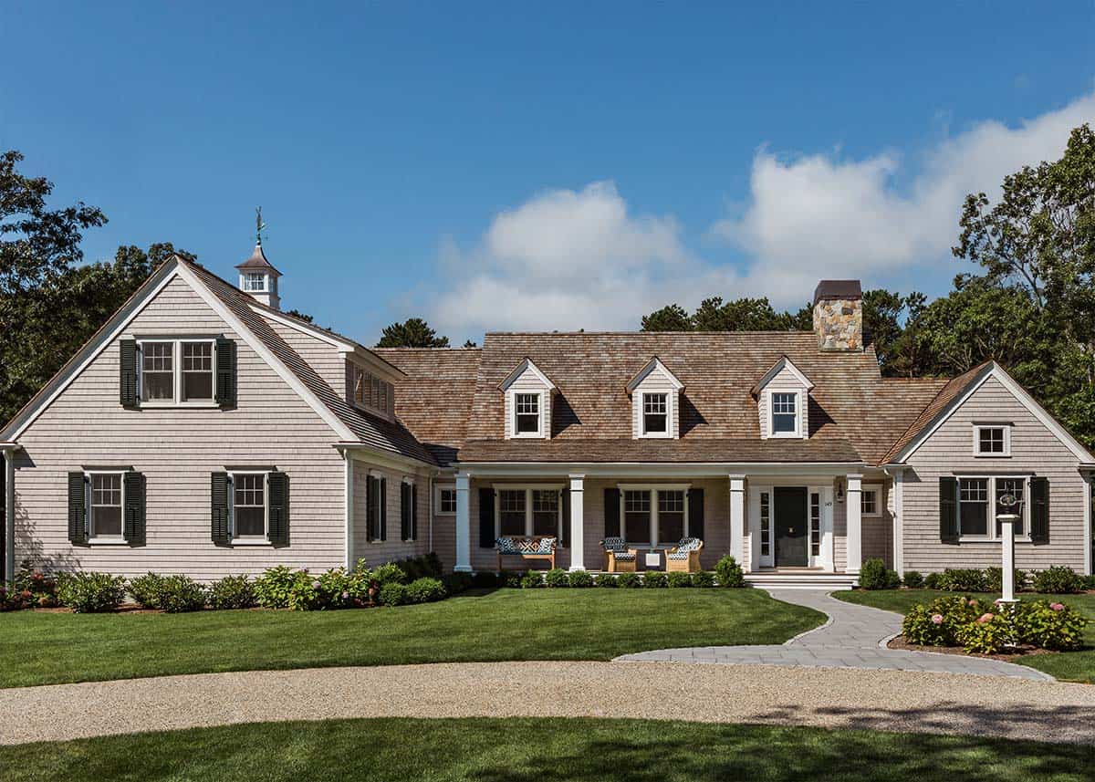 Shingle-style Cape Cod home with dormers and rooftop cupola