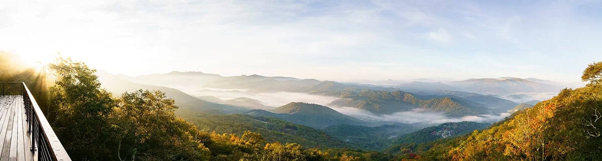 Panoramic view of misty Blue Ridge Mountains from a wraparound deck