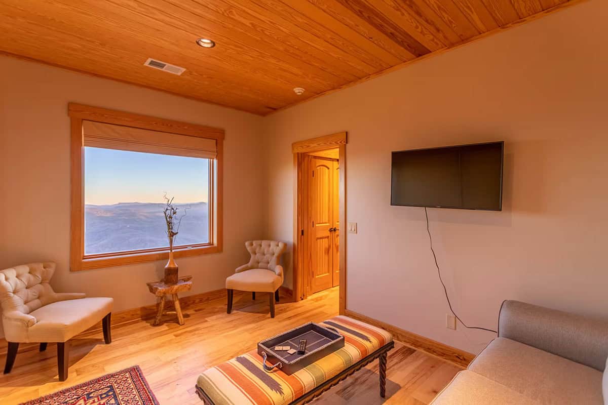 Sitting area with armchairs and mountain view window