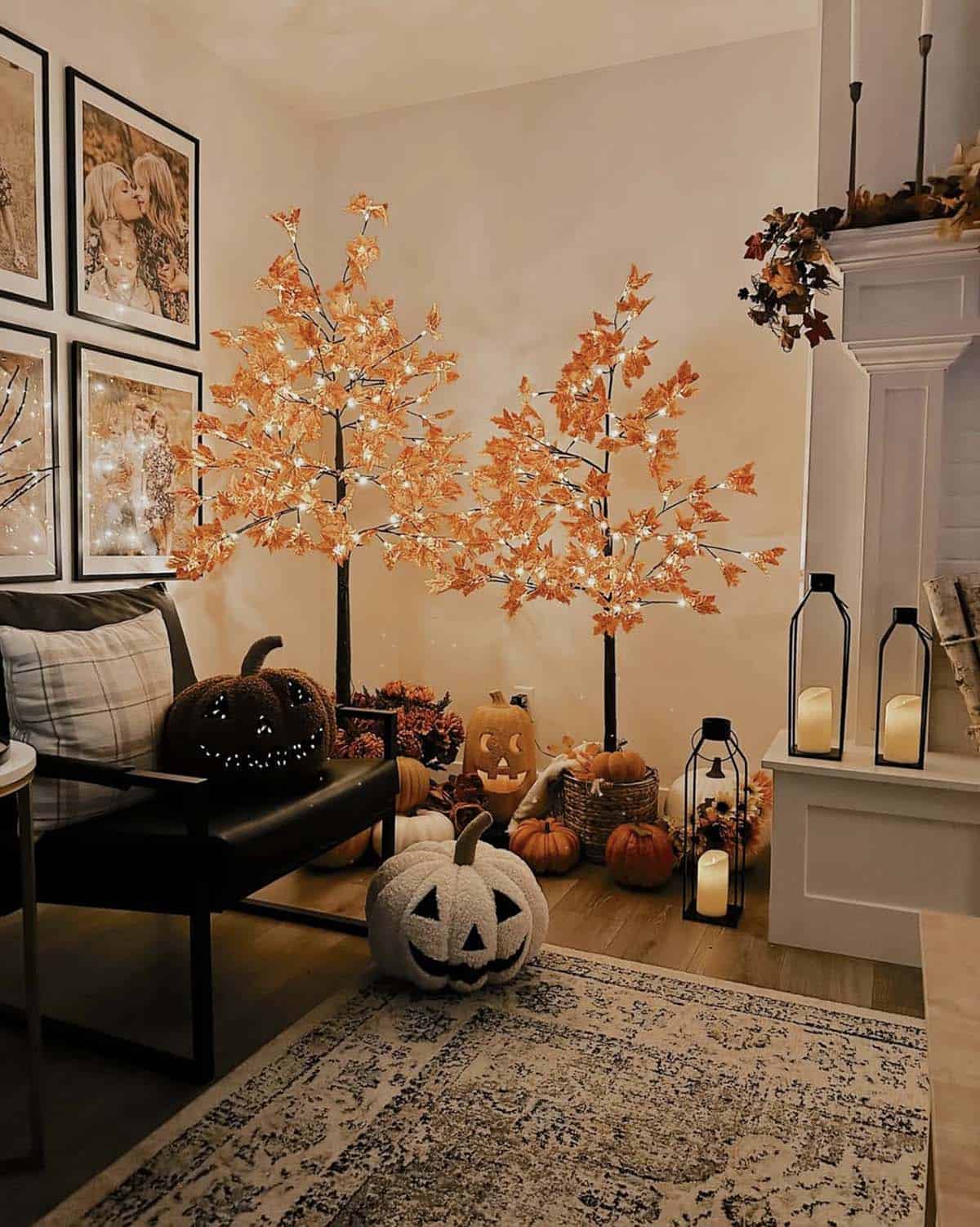 Lit orange leaf trees styled in a living room corner