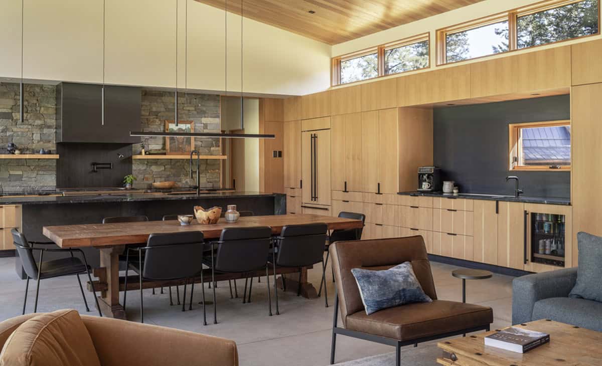 Open concept kitchen and dining area with vaulted wood ceiling