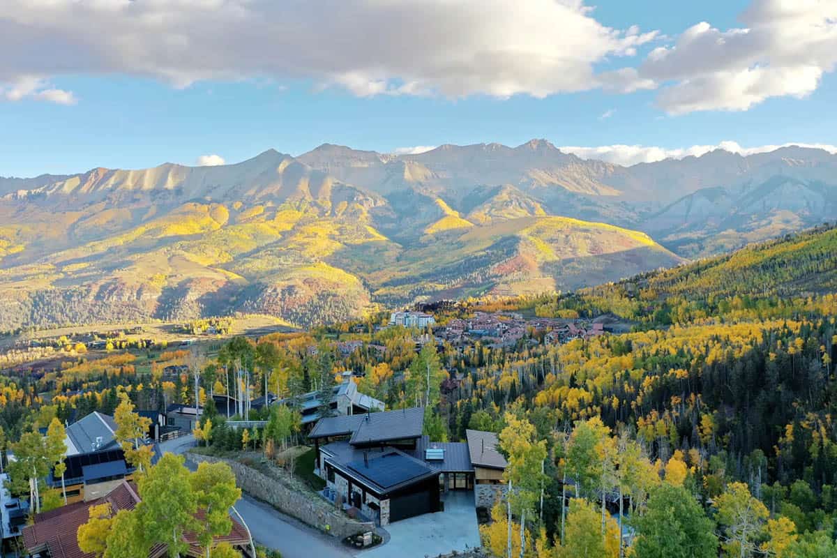 Aerial view of Telluride ski town nestled among fall foliage