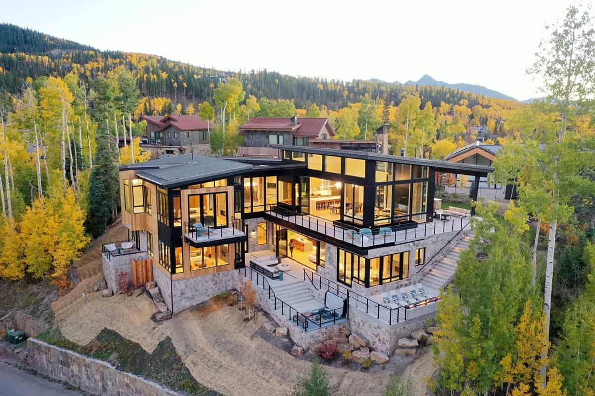 Illuminated rear facade with expansive glass walls at twilight