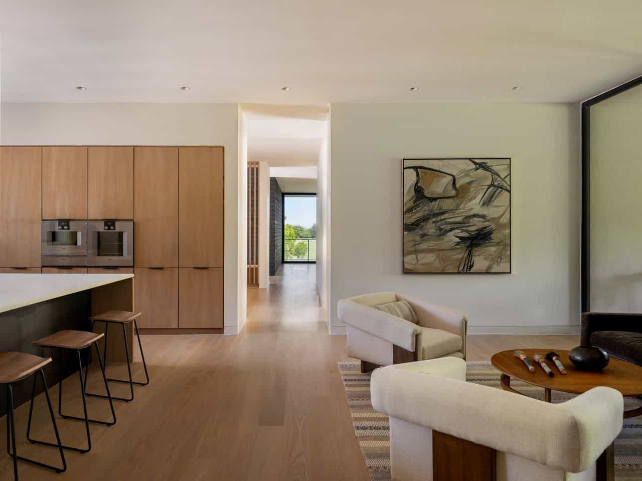 Open kitchen and living area with abstract artwork