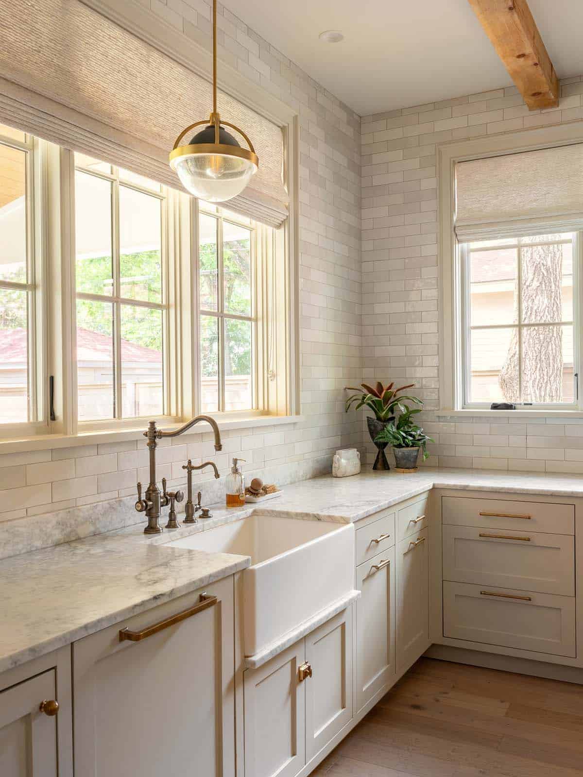 Kitchen prep sink with subway tile and antique brass faucet
