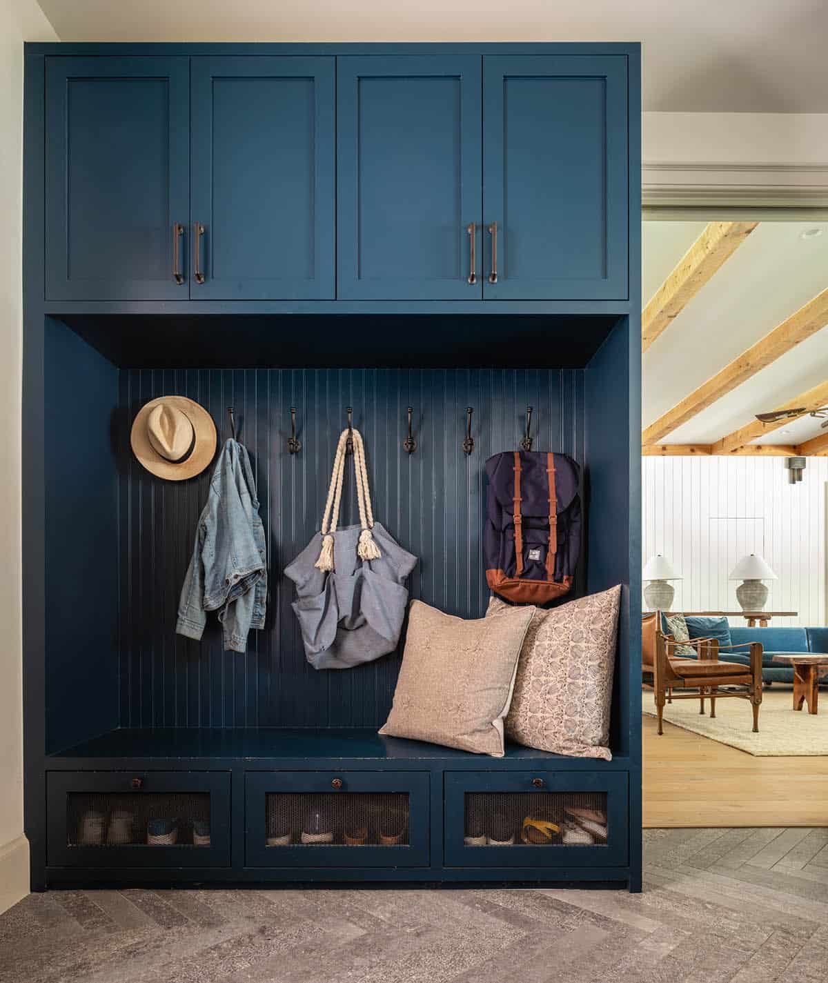 Navy blue mudroom lockers with hooks and mesh shoe drawers