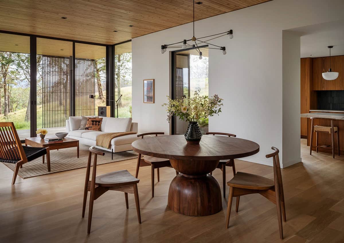 Dining area with chandelier opening to the living room and kitchen