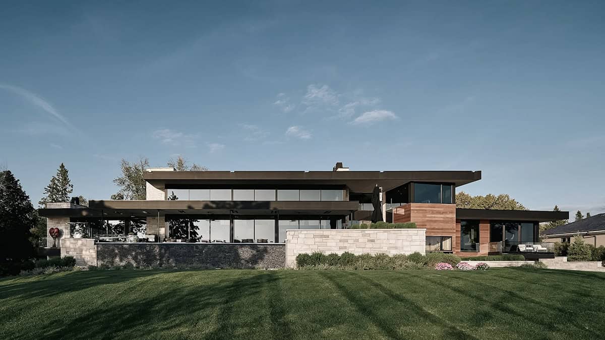 Rear elevation overlooking the lawn toward Dellwood Lake
