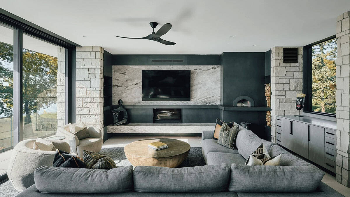 Family room with marble media wall and built in pizza oven