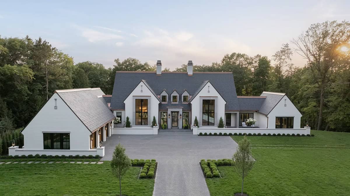 Modern manor home with slate roof and copper gutter details