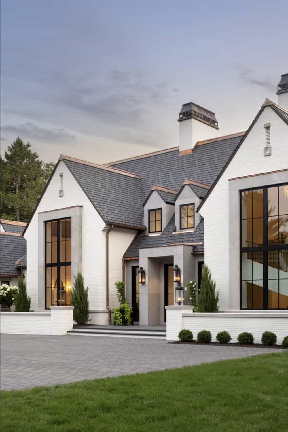 Vertical view of steep gabled roofline with copper flashing details
