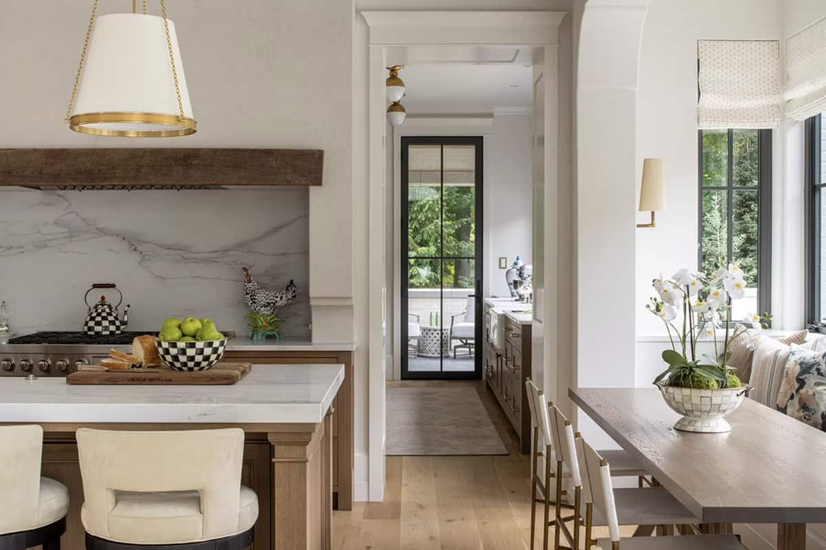 Kitchen island with checkered accessories opening to hallway beyond