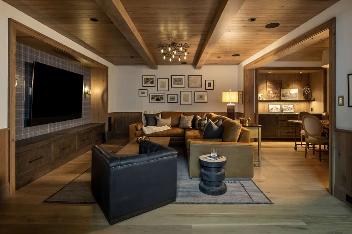 Media room with leather sectional and gallery wall display