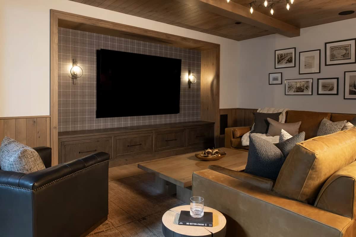 Plaid accent wall behind mounted television in media room