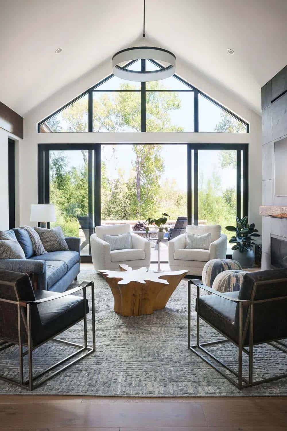 Vaulted living room with glass gable wall and live-edge coffee table