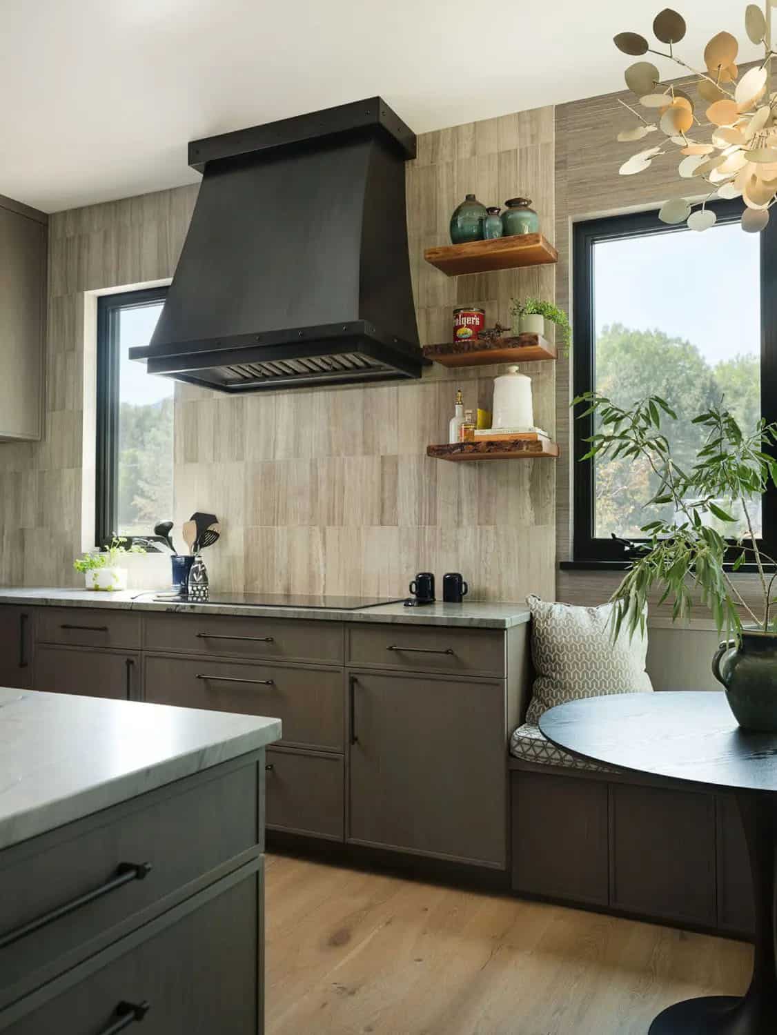 Kitchen range wall with black hood, live-edge shelves, and striated tile backsplash