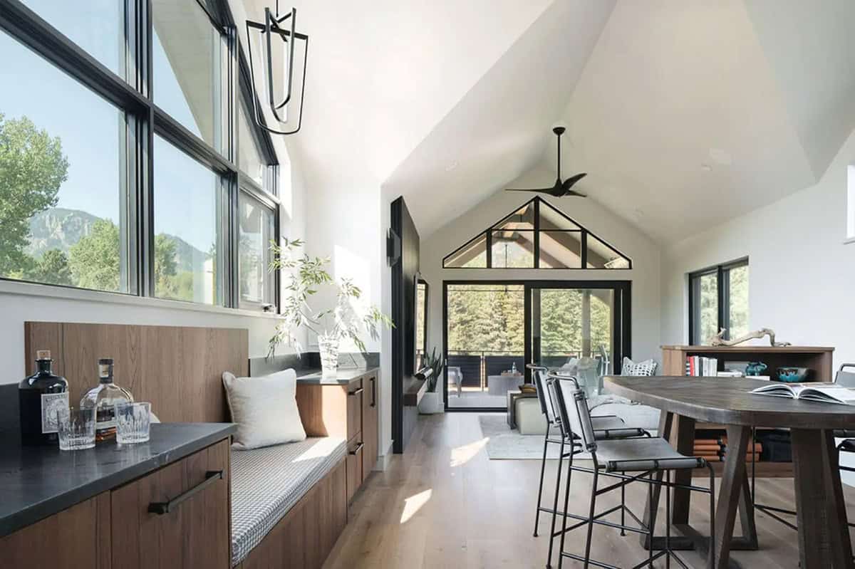 Upstairs loft with window bench, bar counter, and mountain views