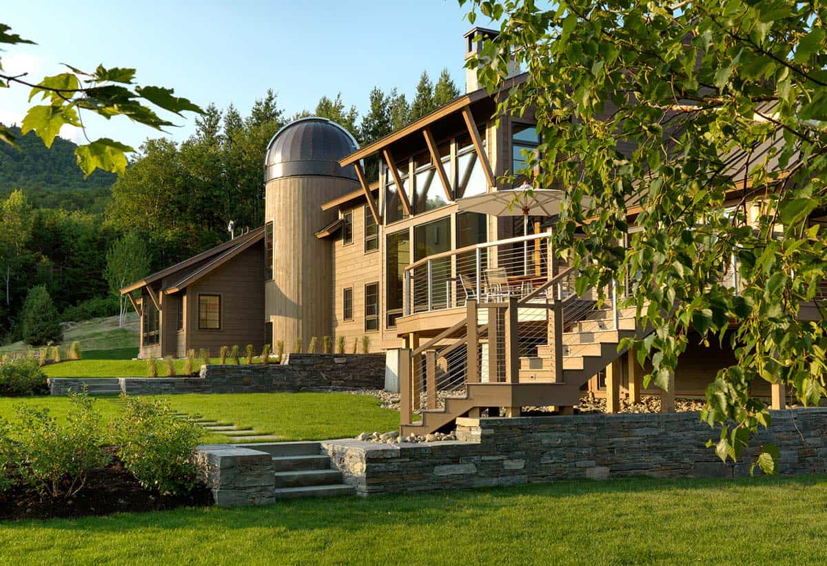 Golden hour view of cedar siding and cable railing deck stairs
