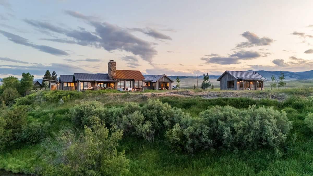 Rustic modern Montana home and fishing cabin at sunset