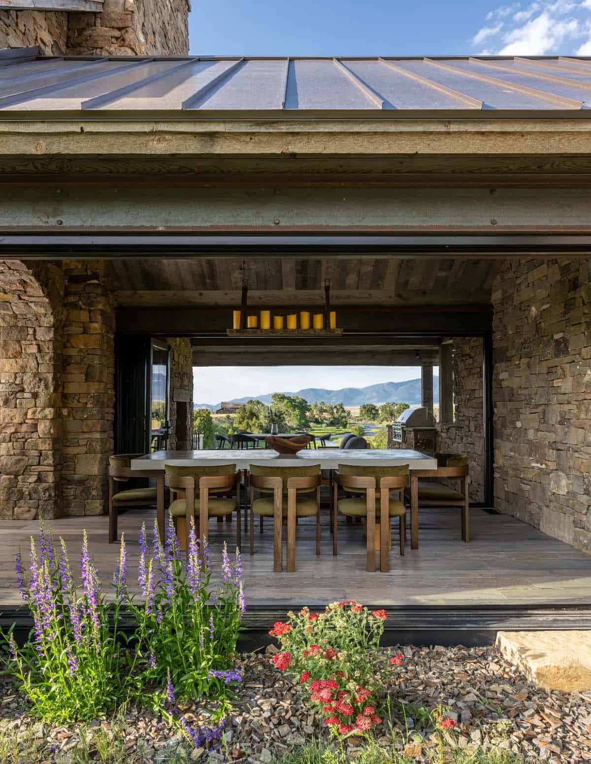 Covered dining area opening to the valley and mountain views