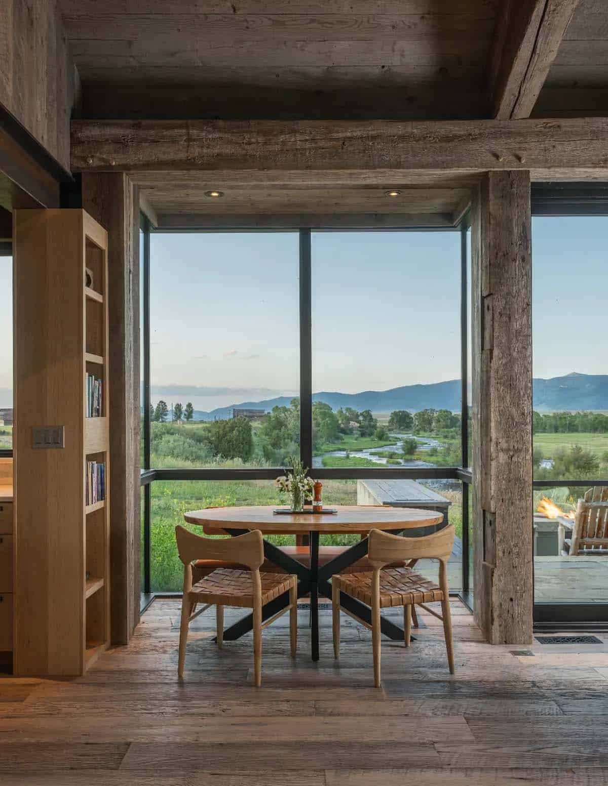 Breakfast nook with corner windows overlooking the stream