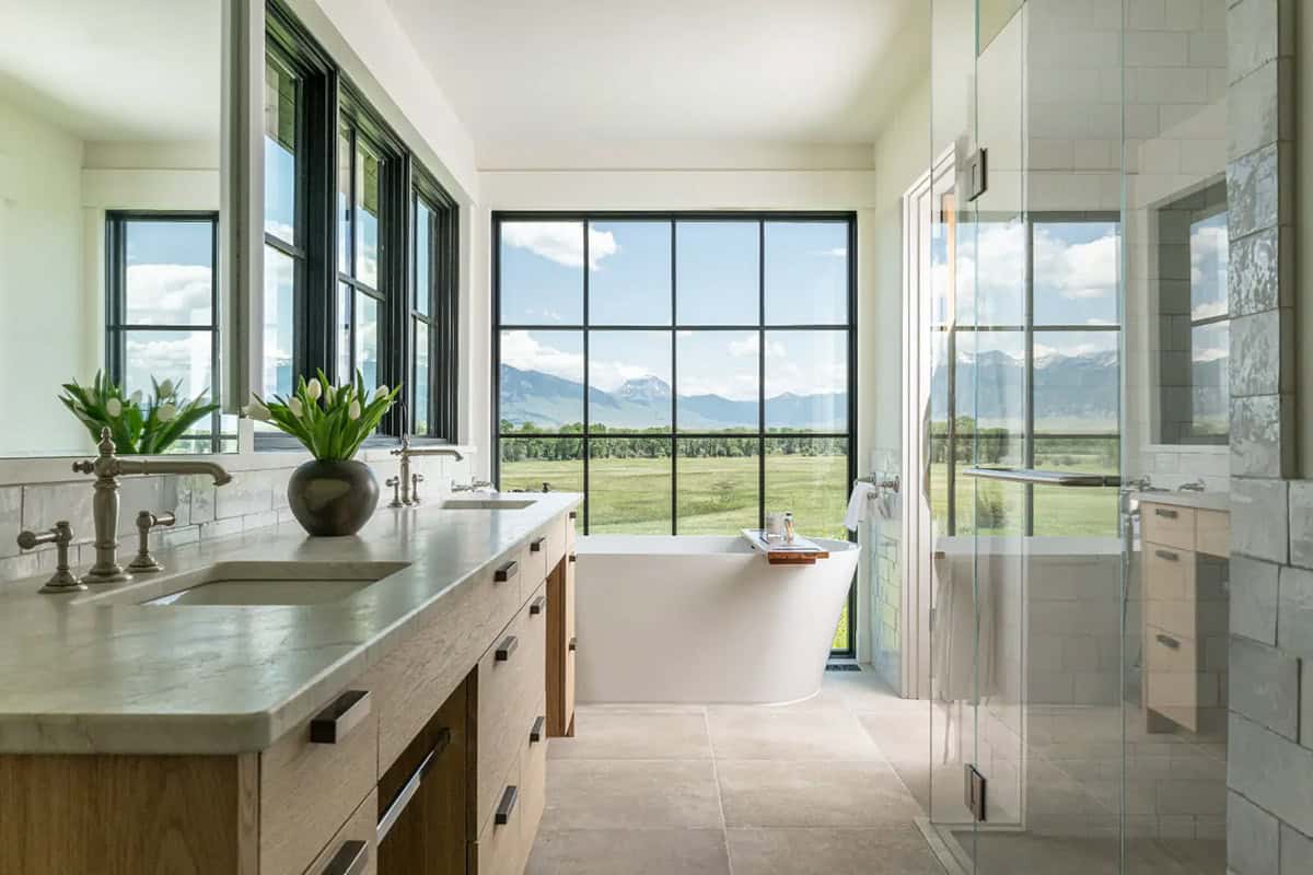 Primary bathroom with freestanding tub and mountain view
