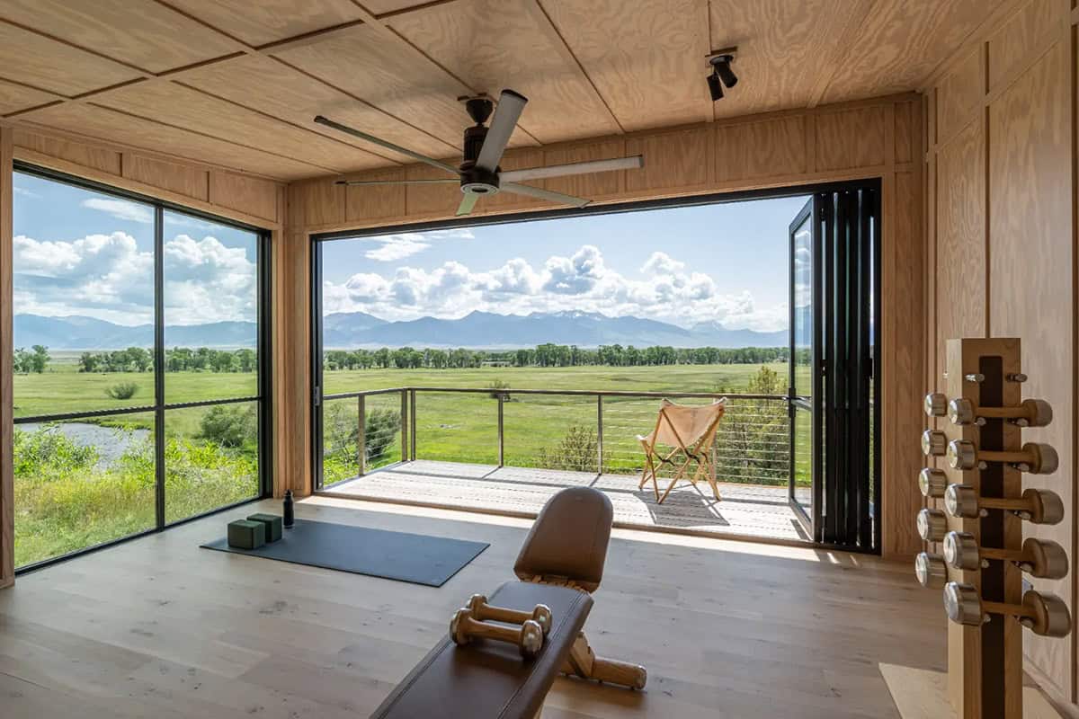 Yoga studio with folding glass wall opening to deck