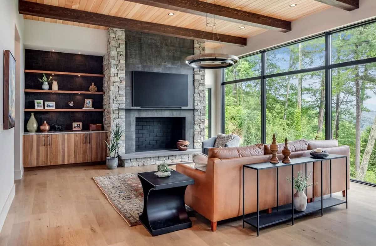 Living room fireplace with stone surround and built in shelving
