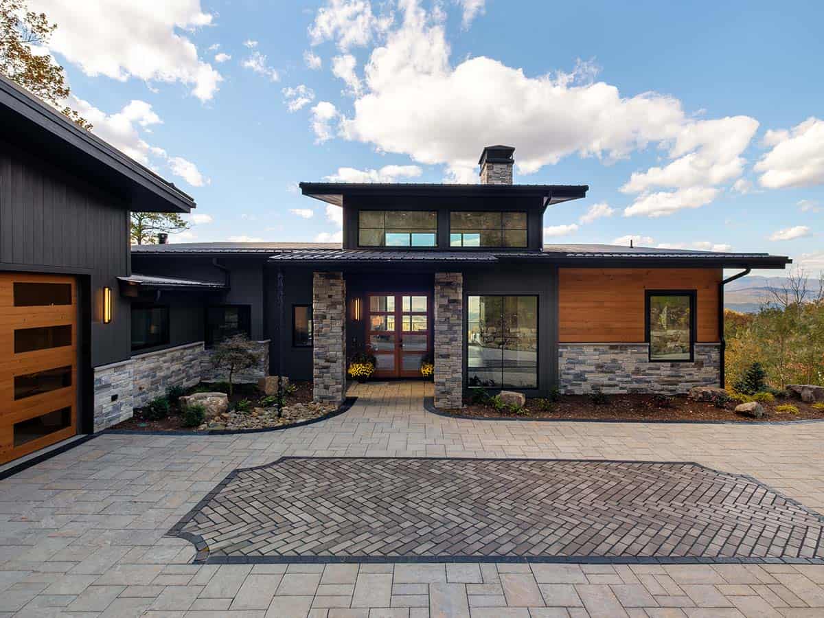 Front entry facade with stacked stone columns and mountain views