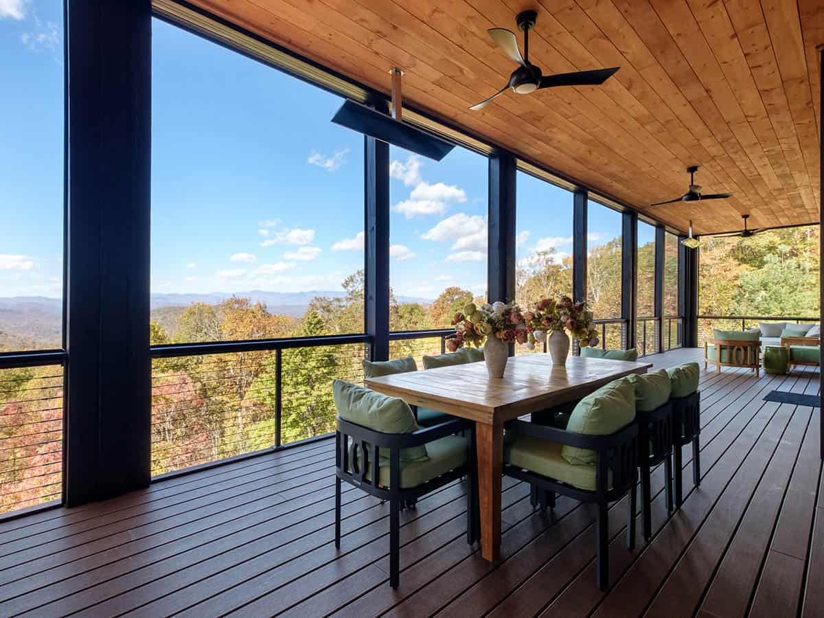 Covered dining deck with outdoor table and mountain vista
