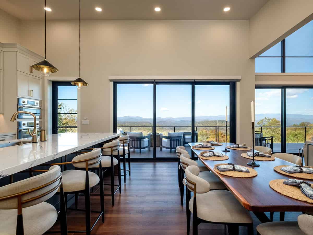 Kitchen and dining space with walnut hood and mountain views