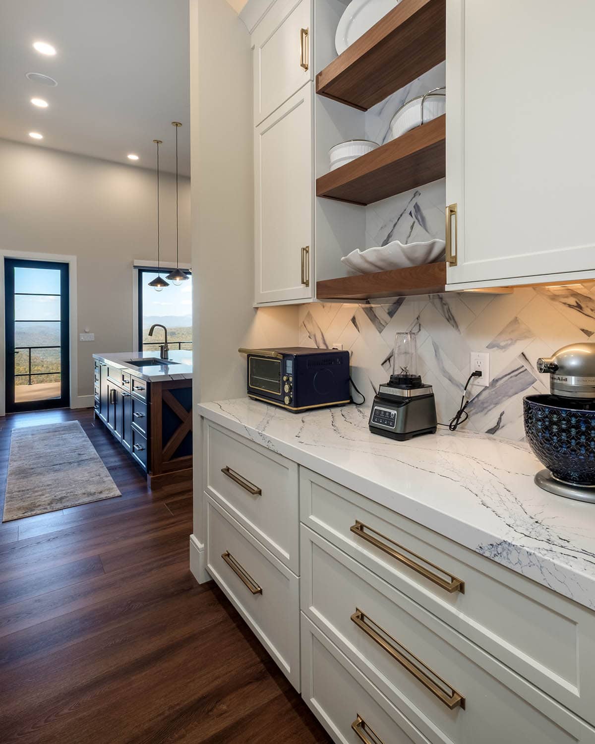 Pantry counter with small appliances and open walnut shelving