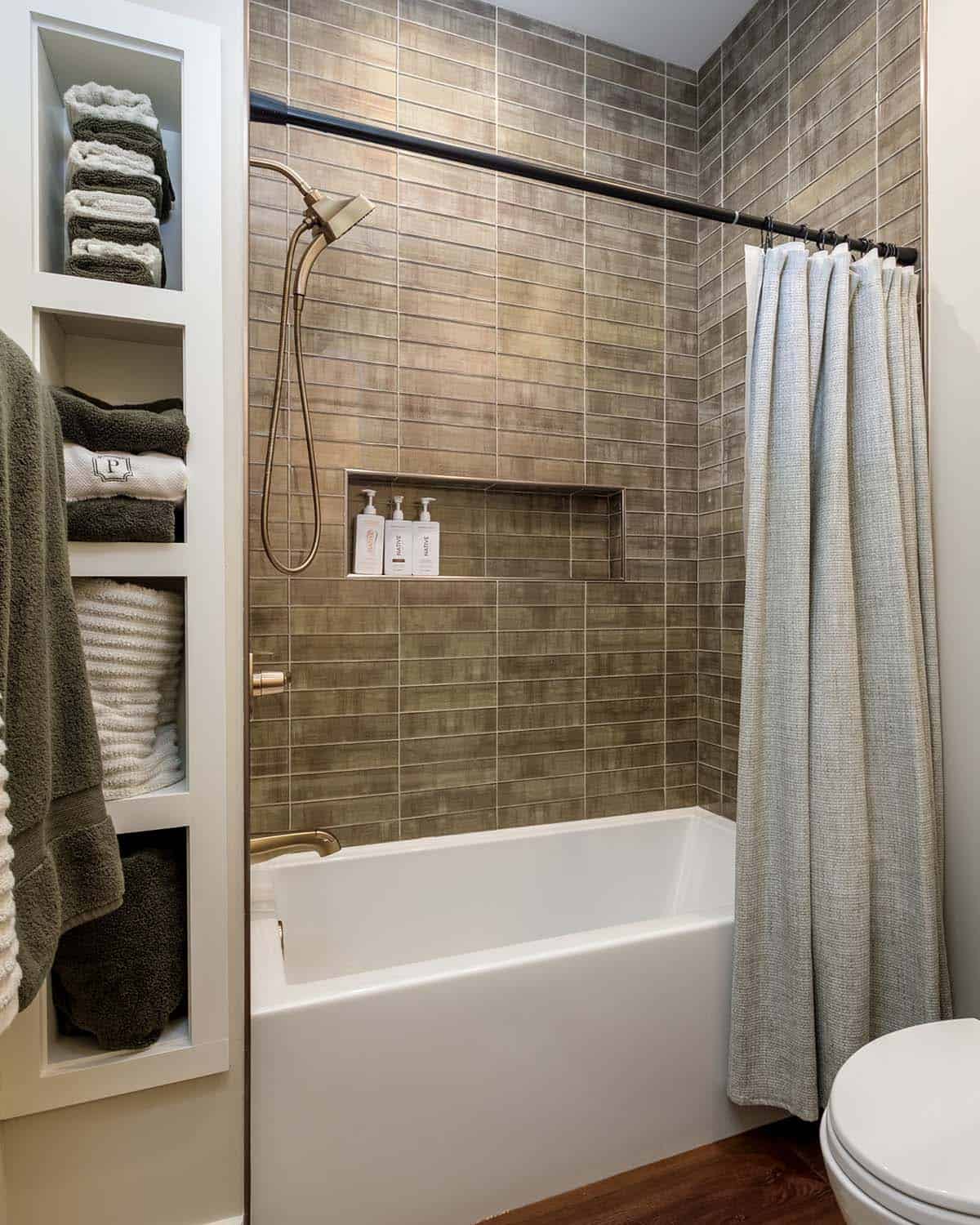 Guest bathroom tub and shower with woven curtain