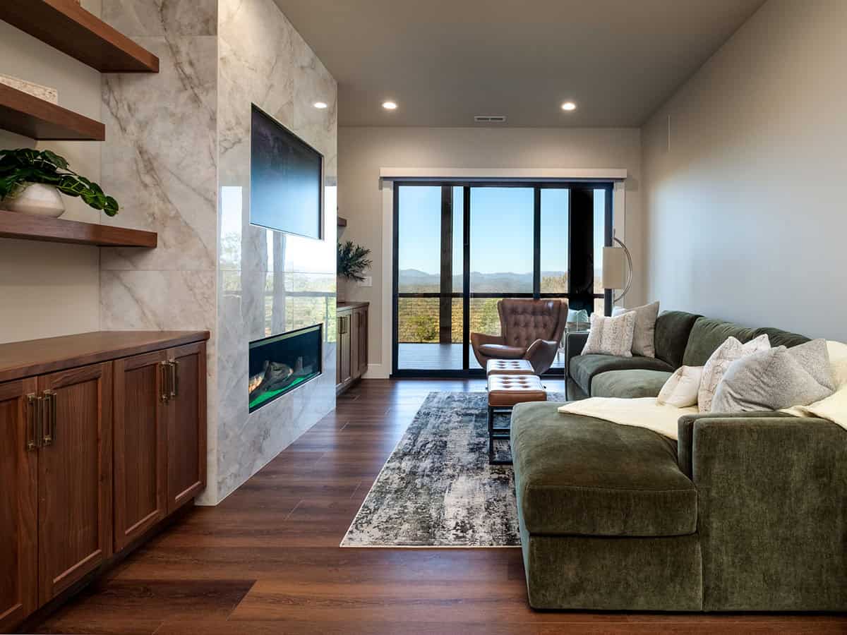 Lower level living area with sectional and glass door access