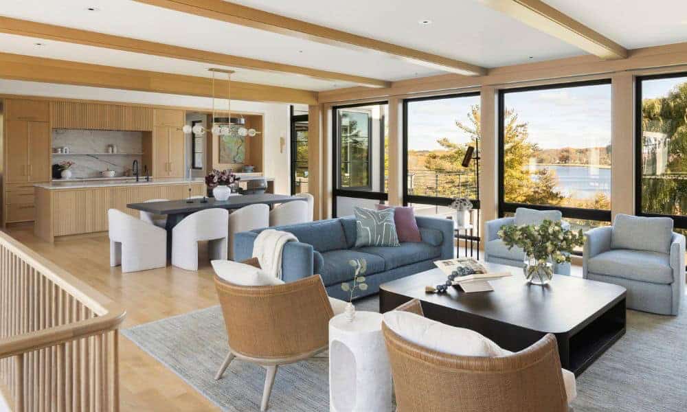 Open living and dining area with lake view through large windows