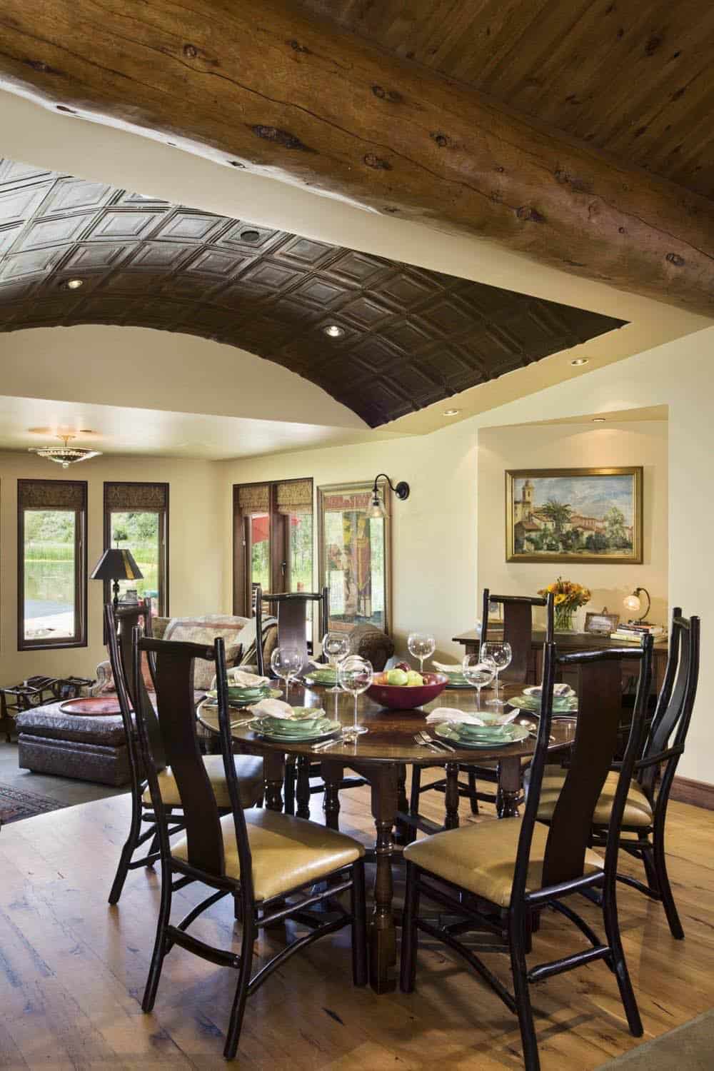 Dining room with tray ceiling and reclaimed timber beam