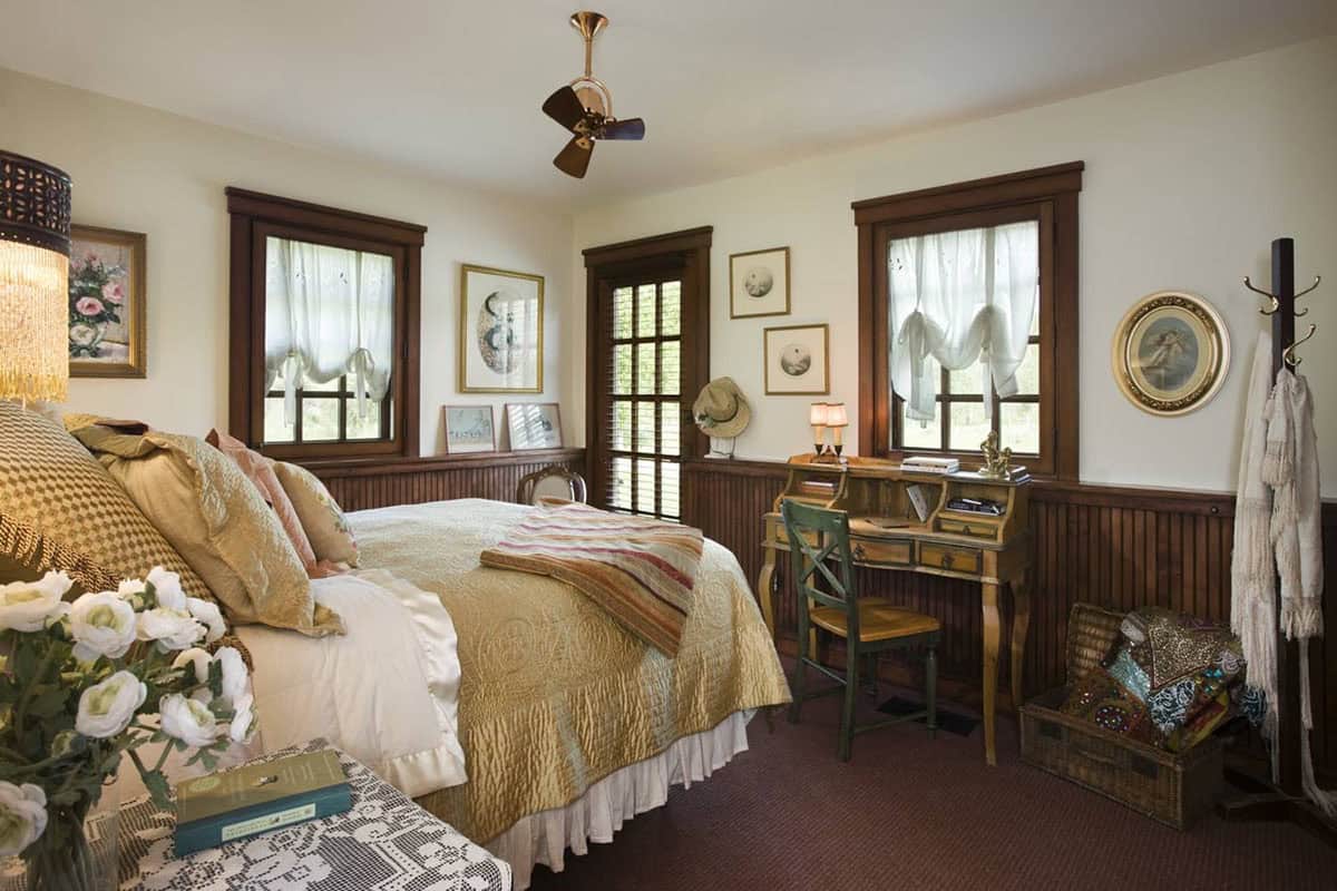 Guest bedroom with white bedding and wood trim