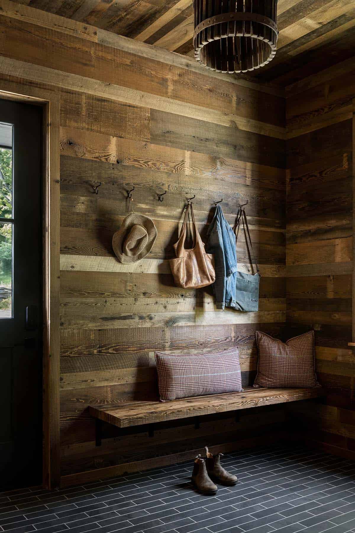 Reclaimed wood entryway with hooks, tote bag, and denim jacket