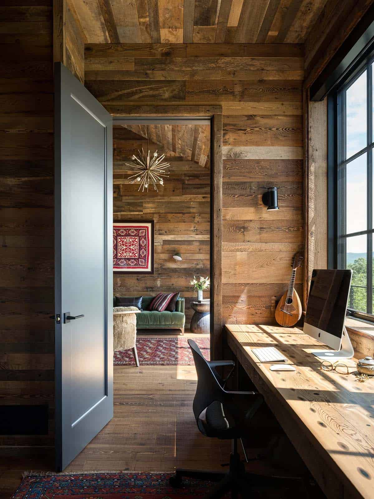 Reclaimed wood home office nook with desk and mountain views