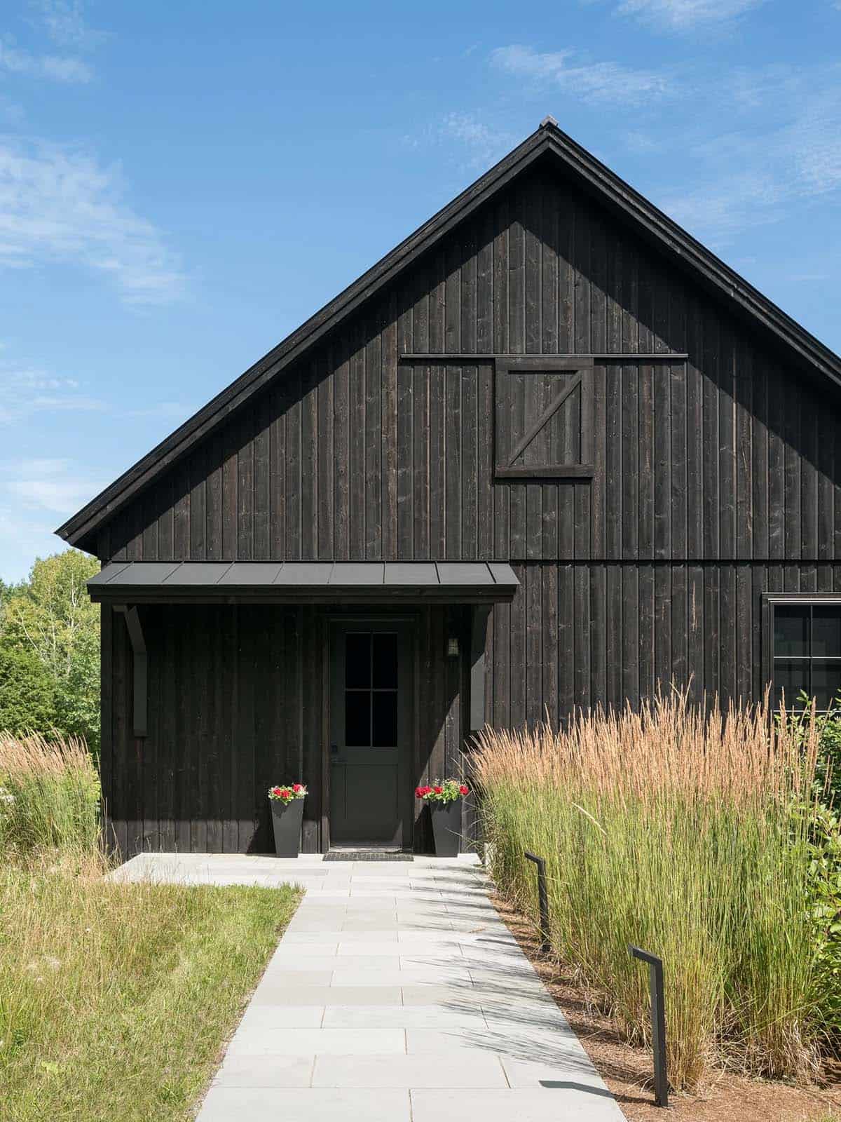 Black board and batten facade with covered front entrance