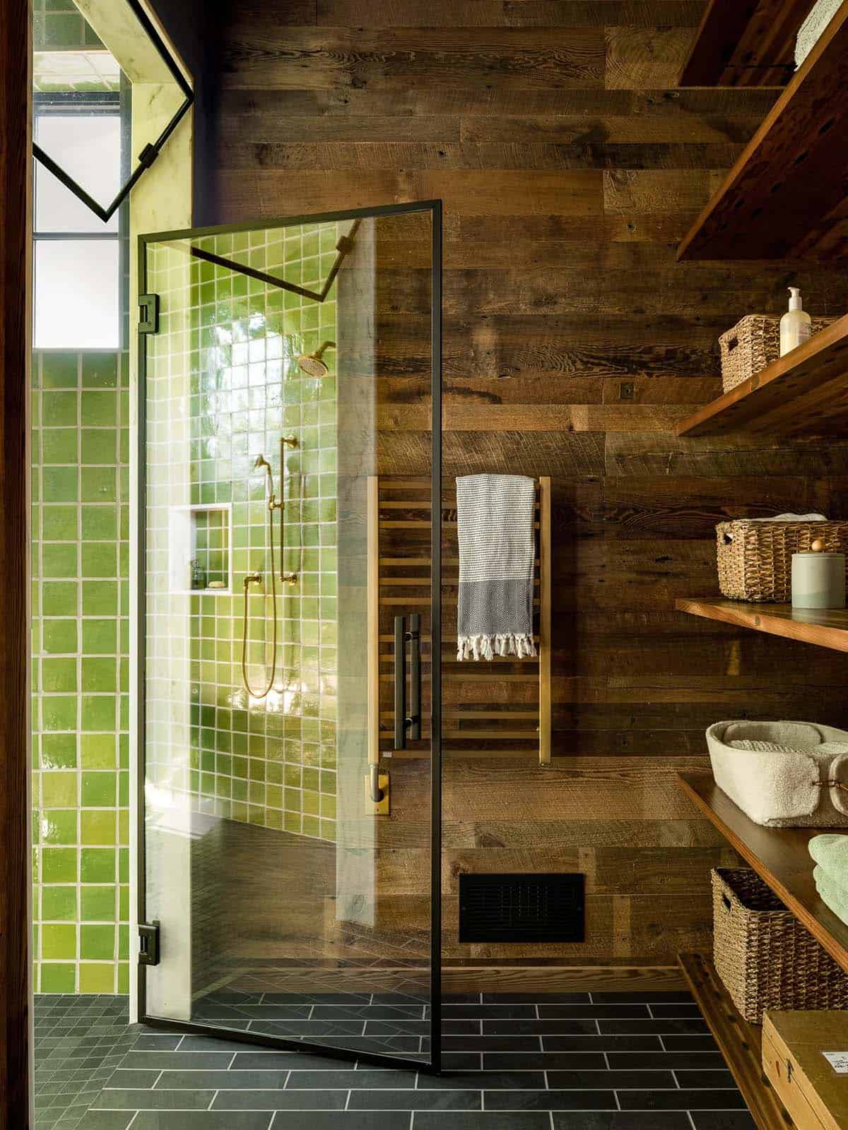 Walk-in shower with green tile and reclaimed wood walls