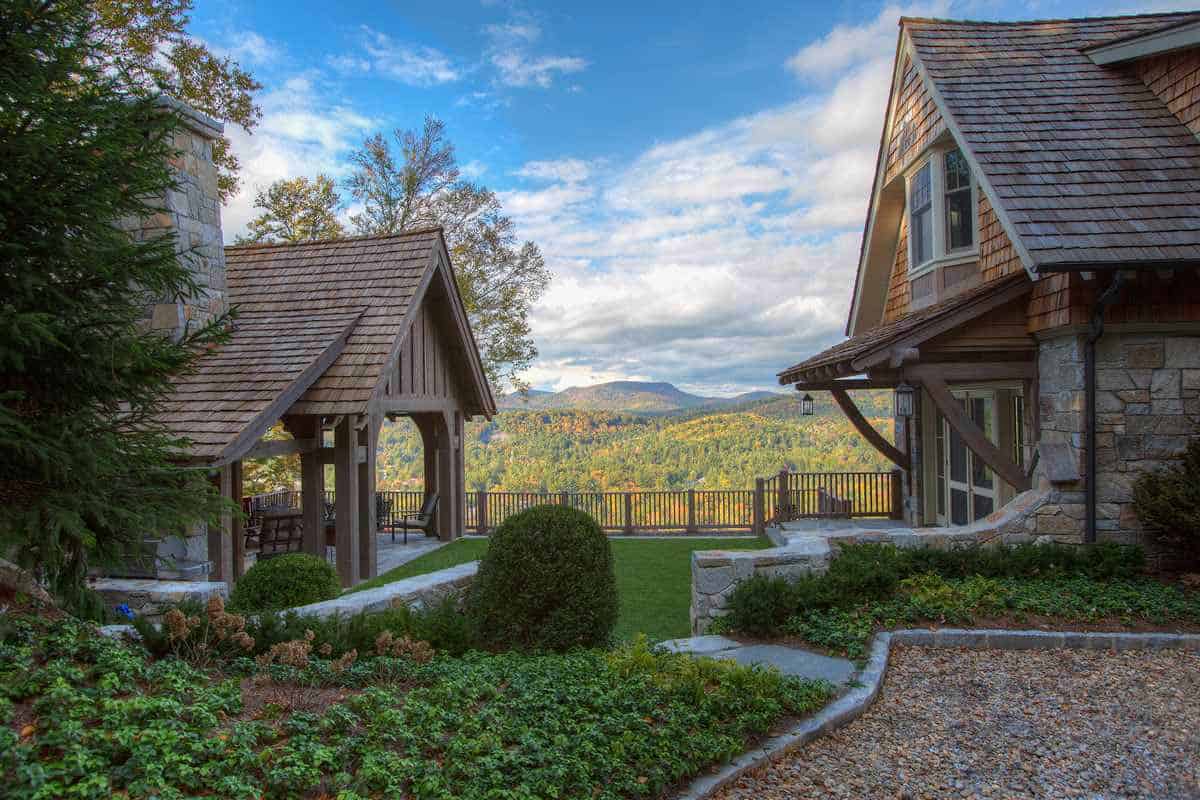 Timber-framed breezeway connecting cottage to covered mountain-view deck