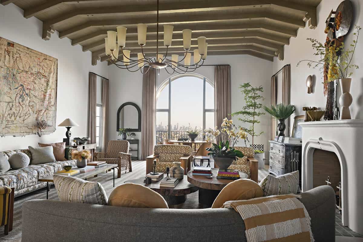 Living room with beamed ceiling, arched window, and skyline view