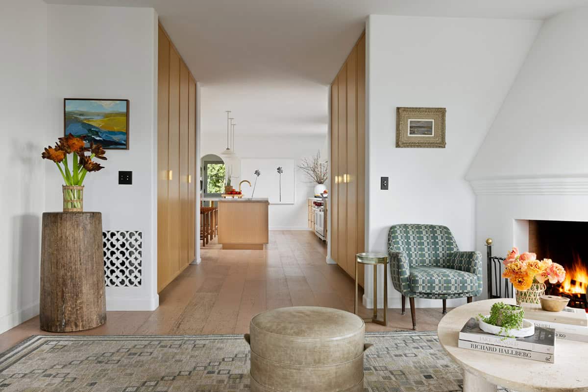 Open hallway with oak cabinetry leading to the kitchen