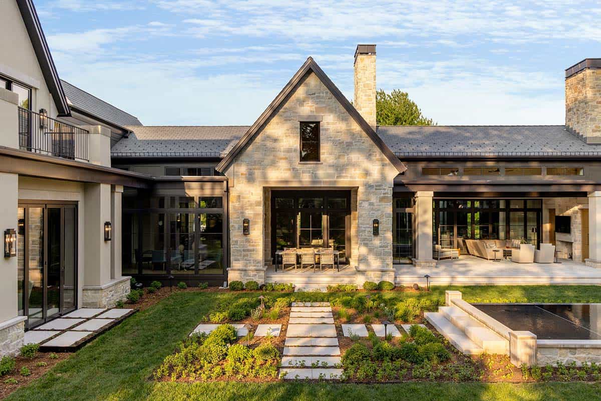 Stone gable framing open-air covered patio and dining space