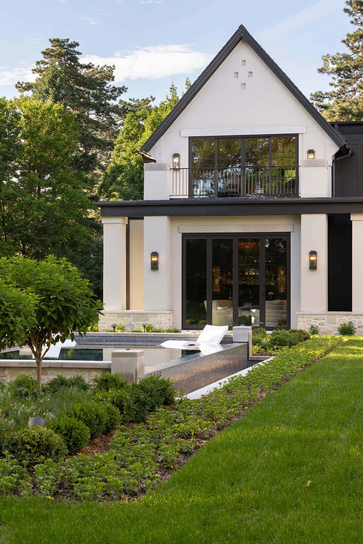 Upper balcony and bar area above tiered reflecting pool