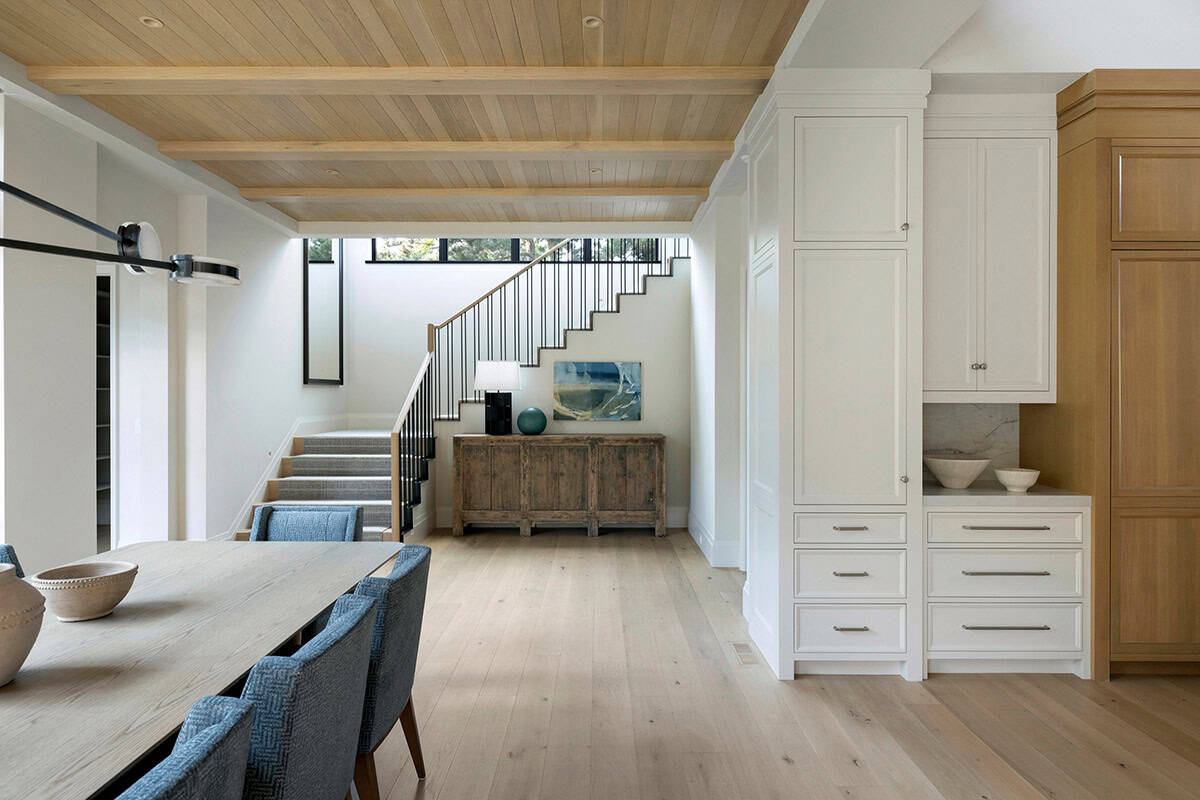 Entry foyer with open staircase and reclaimed wood console table