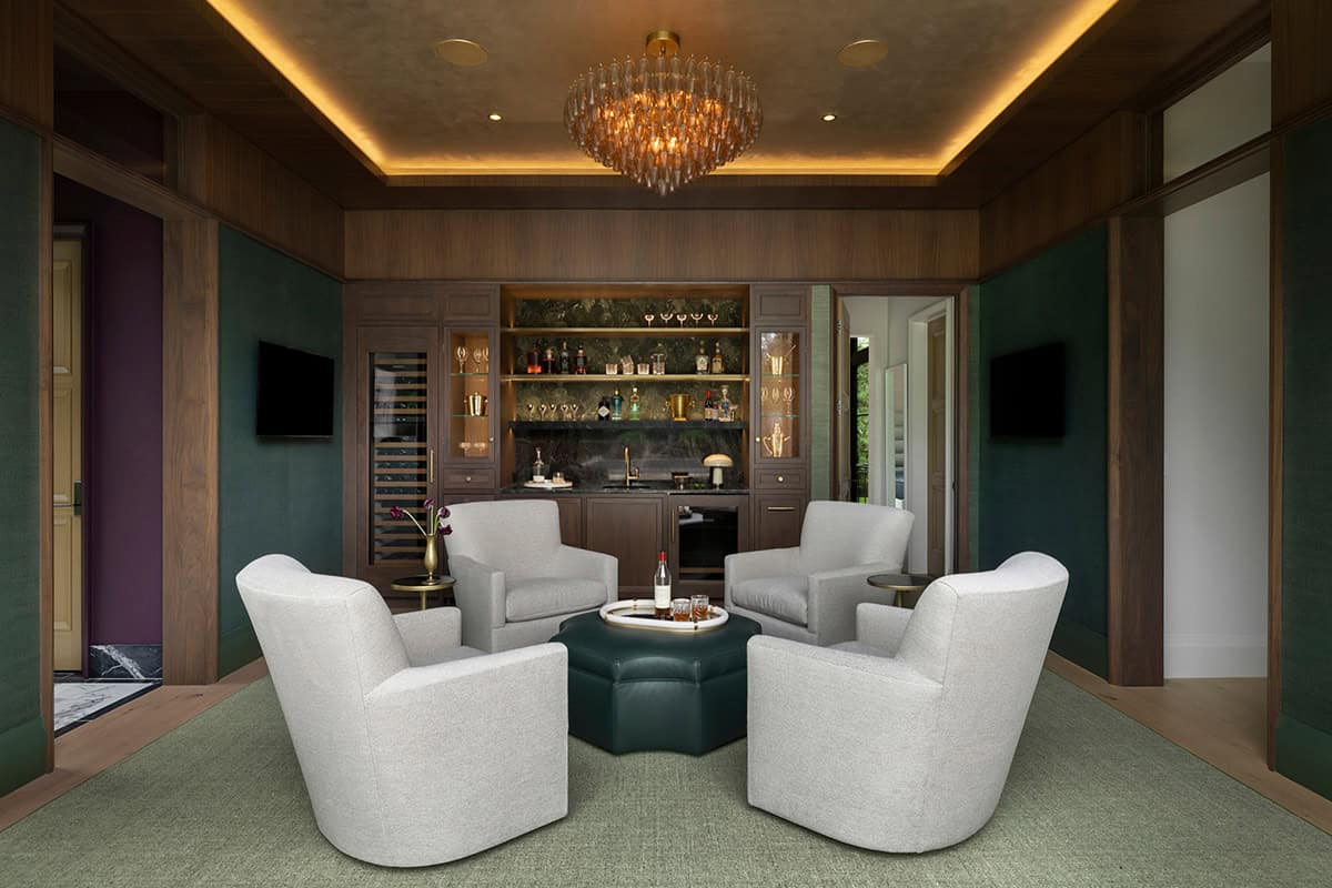 Wood-paneled lounge with crystal chandelier and swivel accent chairs